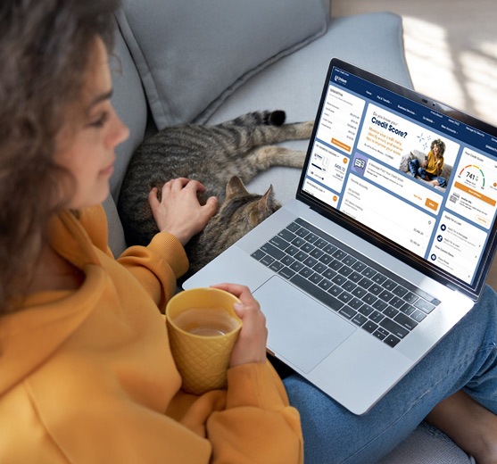Woman working on her laptop while on Unison Credit Unions online banking site
