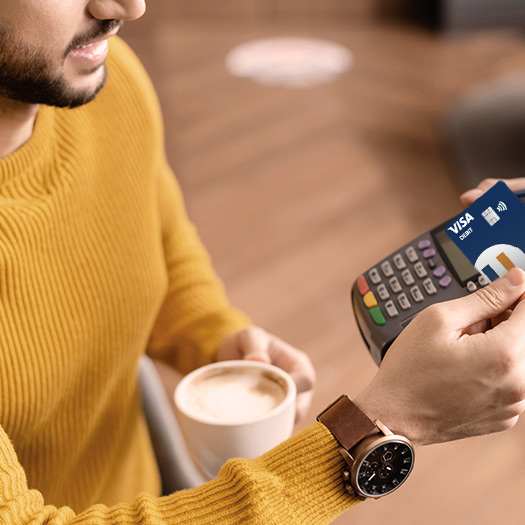 man holding debit card