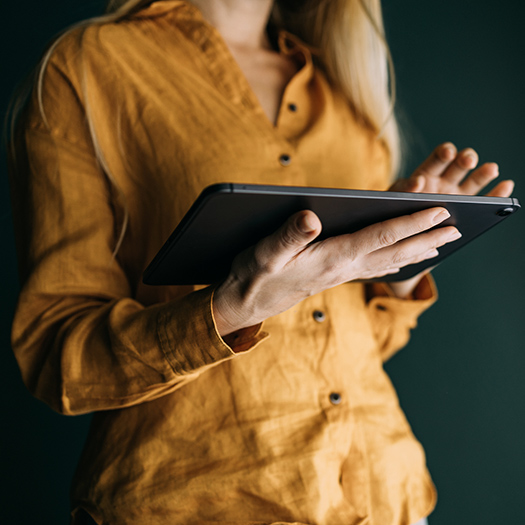 Person reading on a tablet.