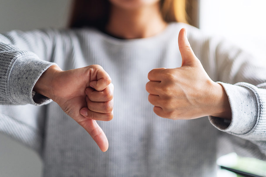 woman thumbs up and thumbs down