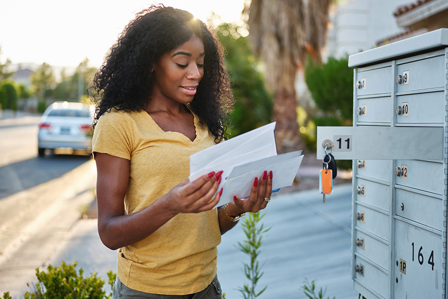 Woman checking her mailbox