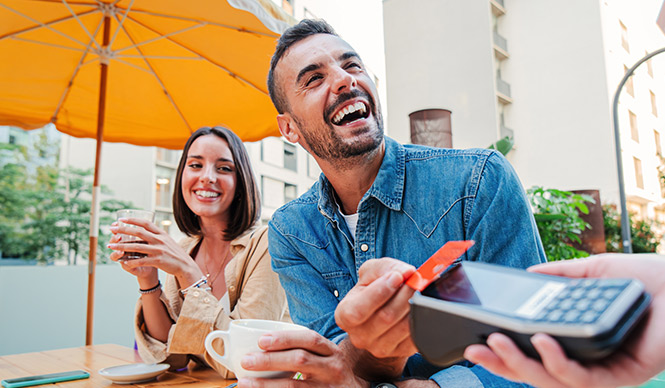 couple using their credit card to pay