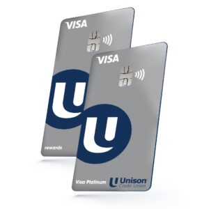 Two silver credit cards with the Unison logo.