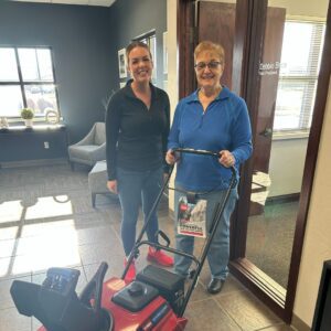 Our Wrightstown branch manager, Marteka, and a member who won a snow blower as a prize.